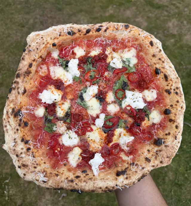 A pizza with 'nduja, fresh chilli and creamy cheese
